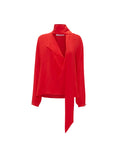 Red long sleeve top with scarf neck design detail. Set against a white background. 