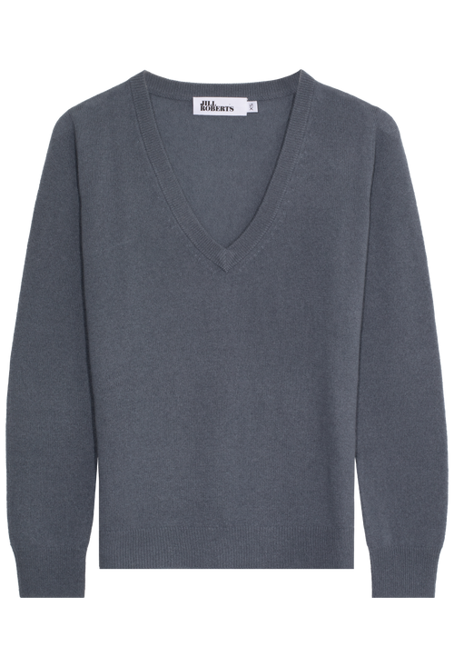 Gray sweater with a brand label on a white background