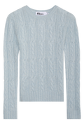 Light blue cable knit sweater on a white background