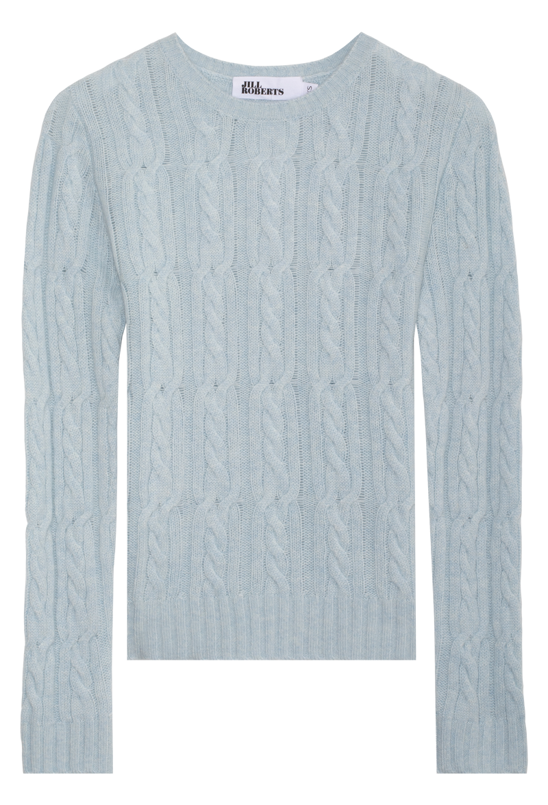 Light blue cable knit sweater on a white background