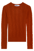 Orange cable knit sweater on a white background