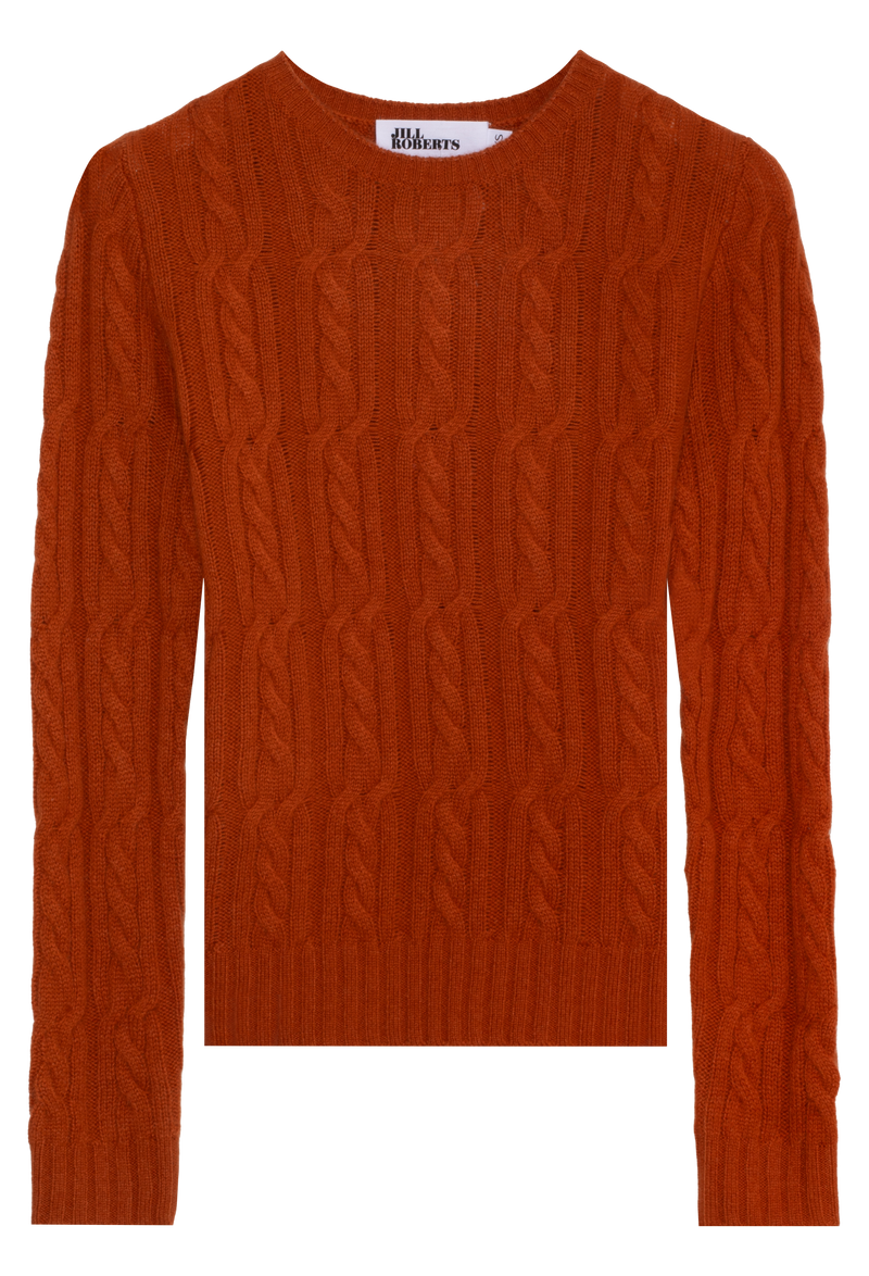 Orange cable knit sweater on a white background