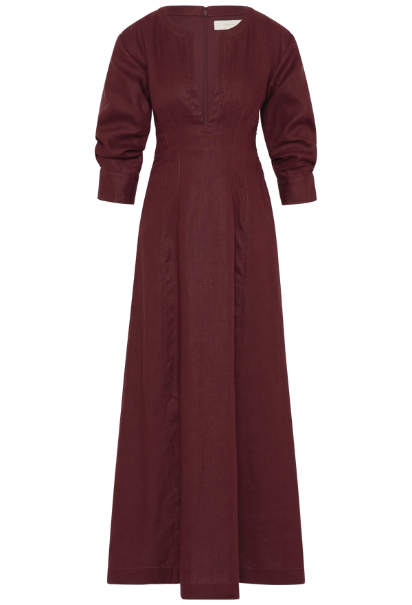 a midi burgundy dress with 3/4 sleeves and a deep v-neck. white background.