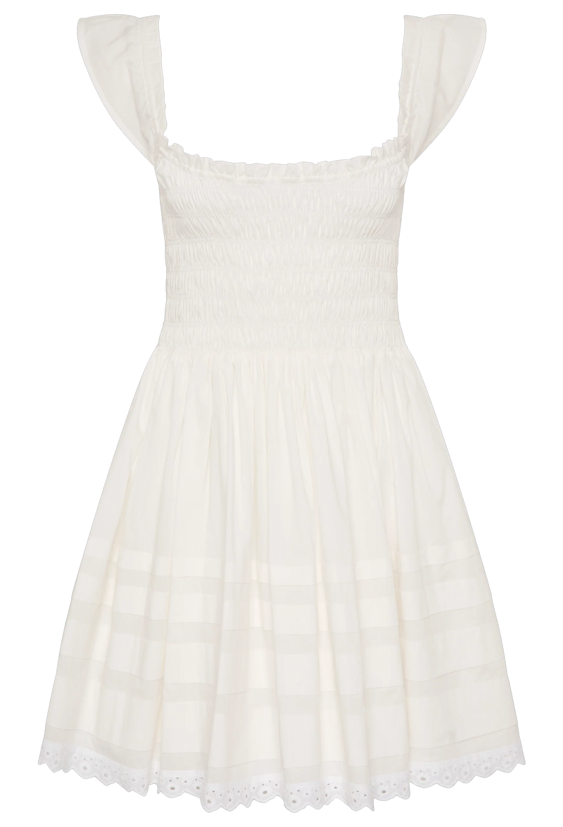 a white mini dress with a shirred bodice and cap sleeves. white background