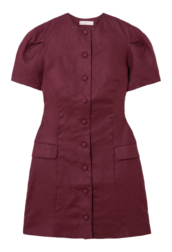 a burgundy short sleeve mini dress with flap pockets and covered buttons. white background.