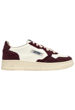 Sneaker with maroon and white design on a white background