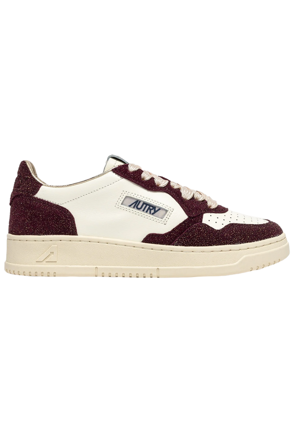 Sneaker with maroon and white design on a white background