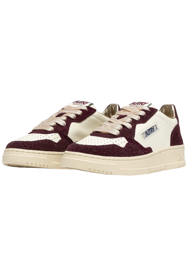 Maroon and white sneakers on a white background