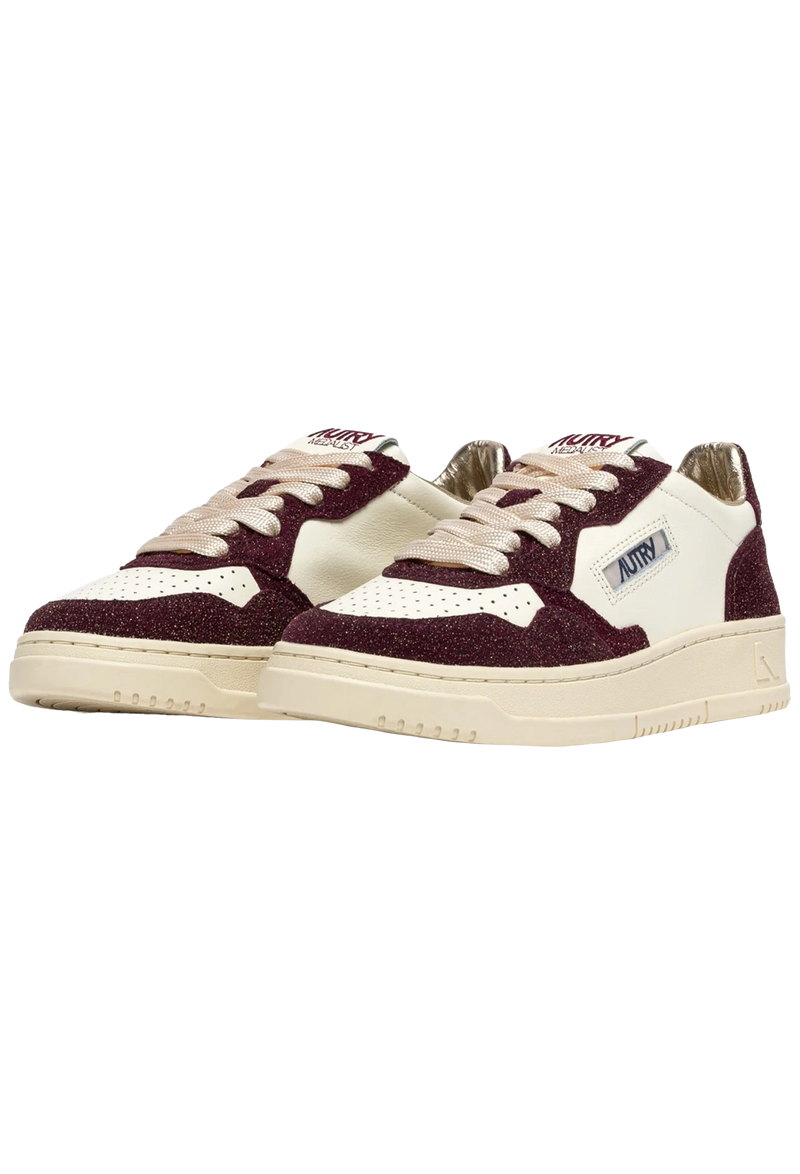Maroon and white sneakers on a white background