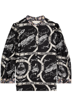 Black and white patterned blouse on a white background