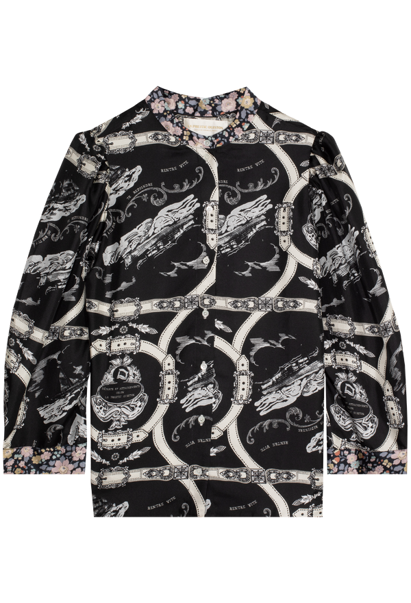Black and white patterned blouse on a white background