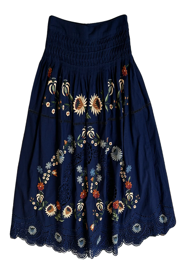 Navy blue skirt with floral embroidery on a white background