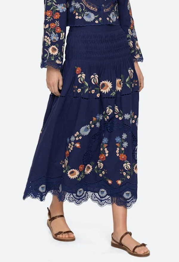 Navy blue skirt with floral embroidery on a white background