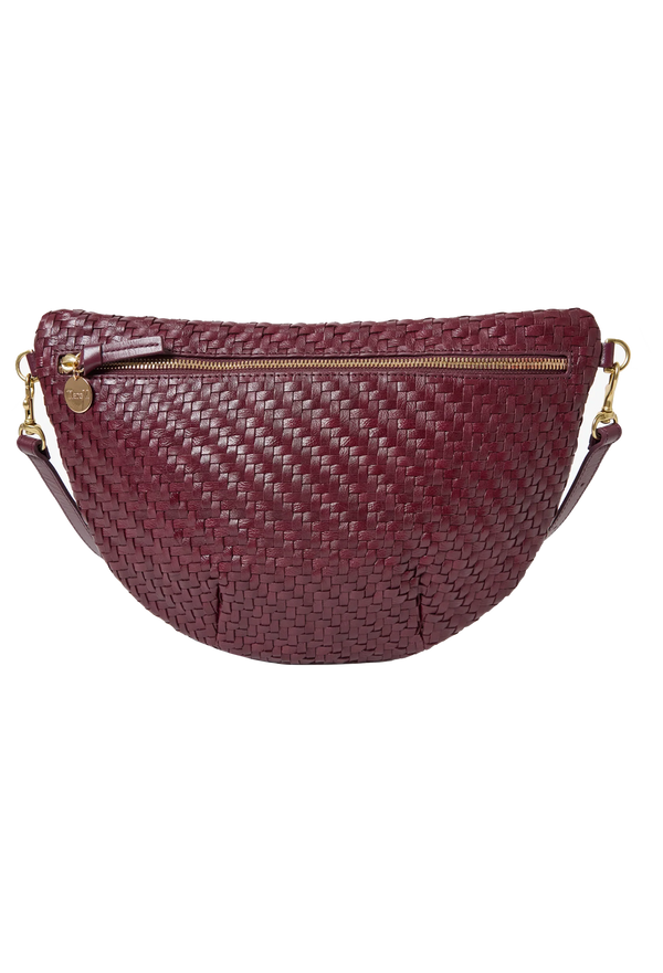 Woven burgundy fanny pack with gold accents on a white background