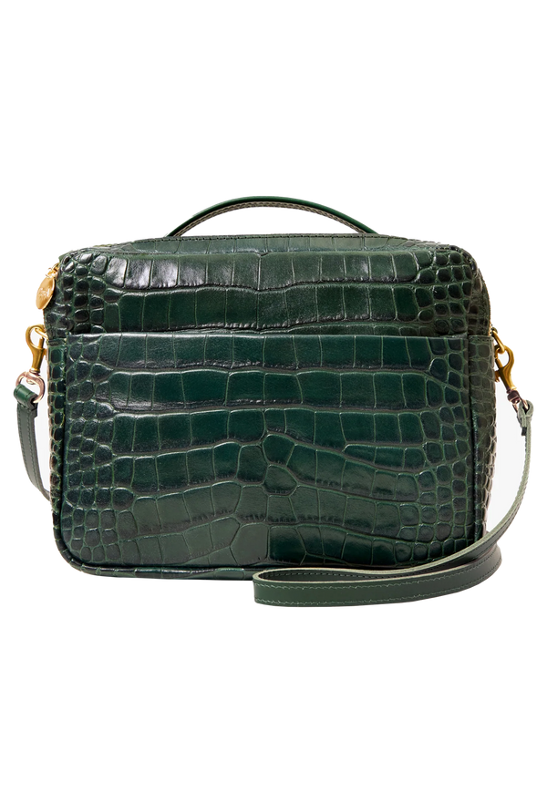 Green crocodile-patterned handbag with gold accents on a white background