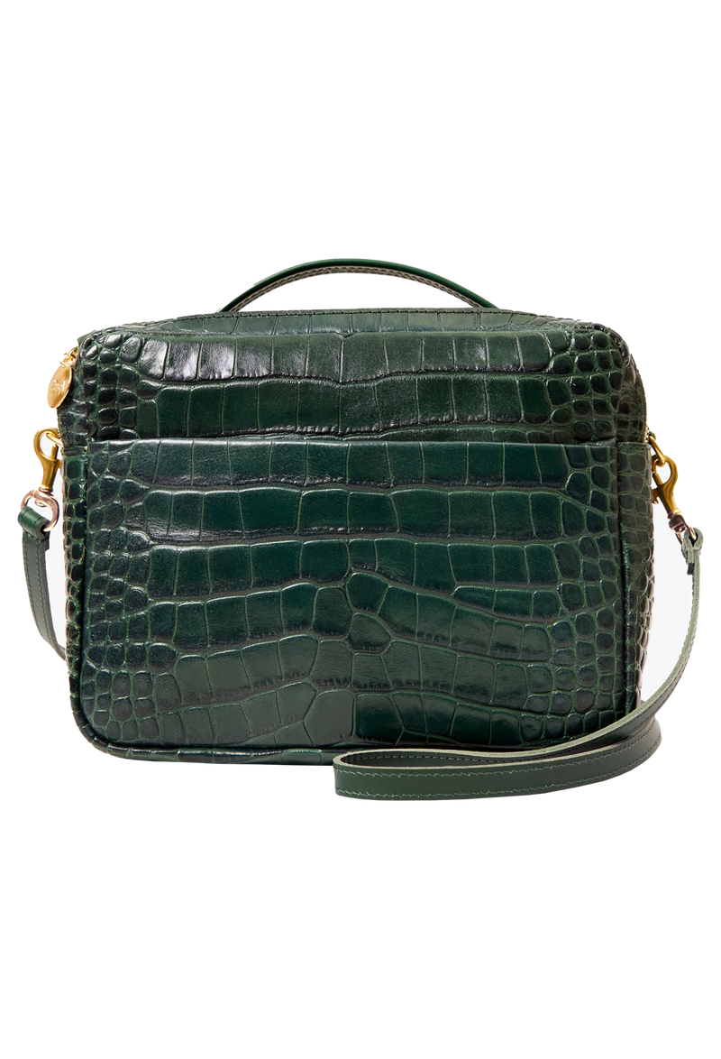 Green crocodile-patterned handbag with gold accents on a white background