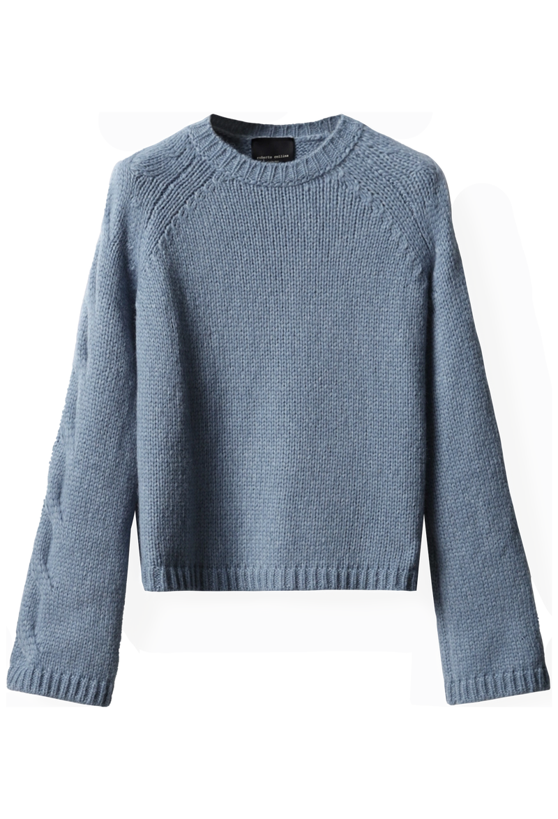 Blue knitted sweater on a white background
