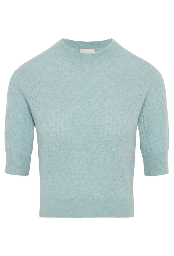 Light blue sweater with short sleeves on a white background