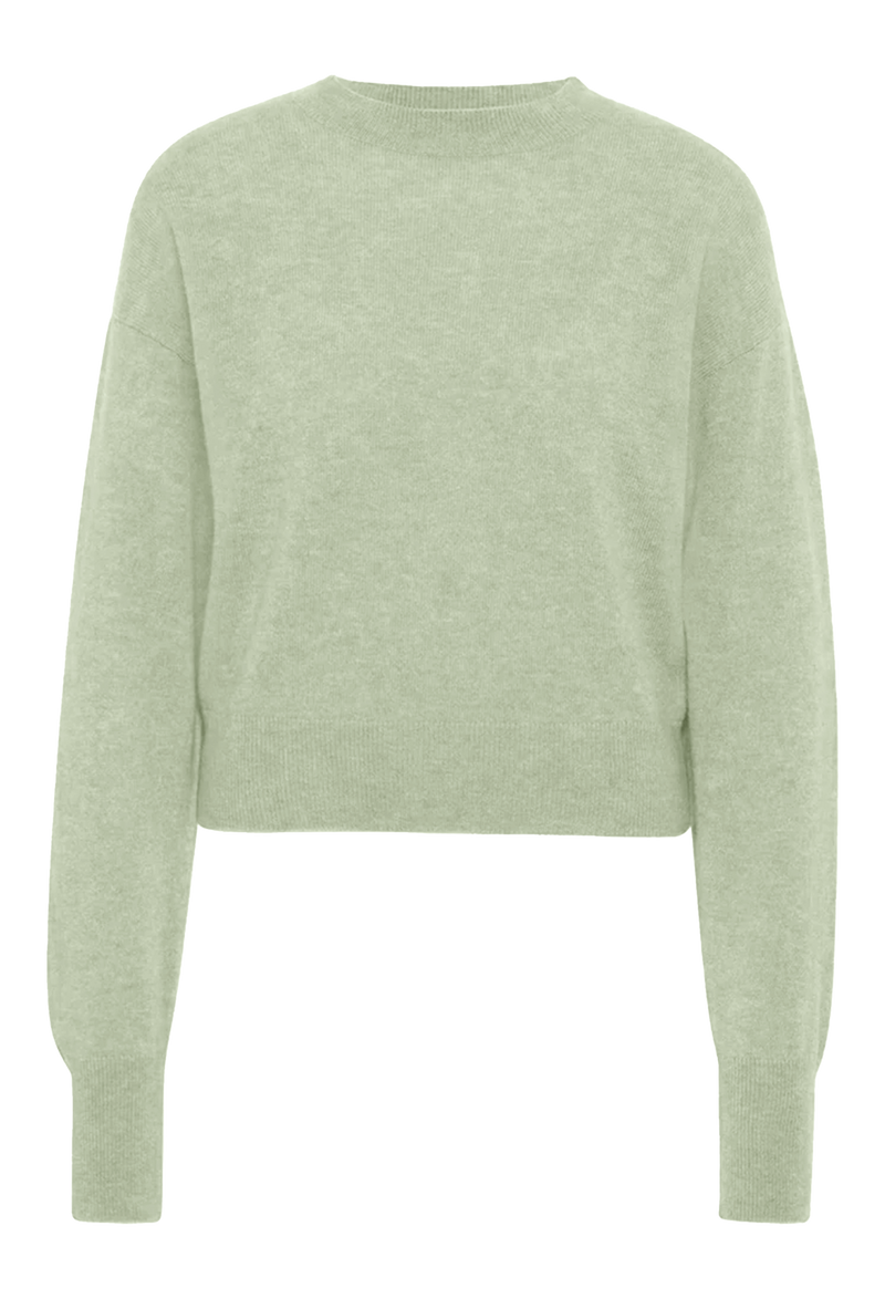 Light green sweater on a white background