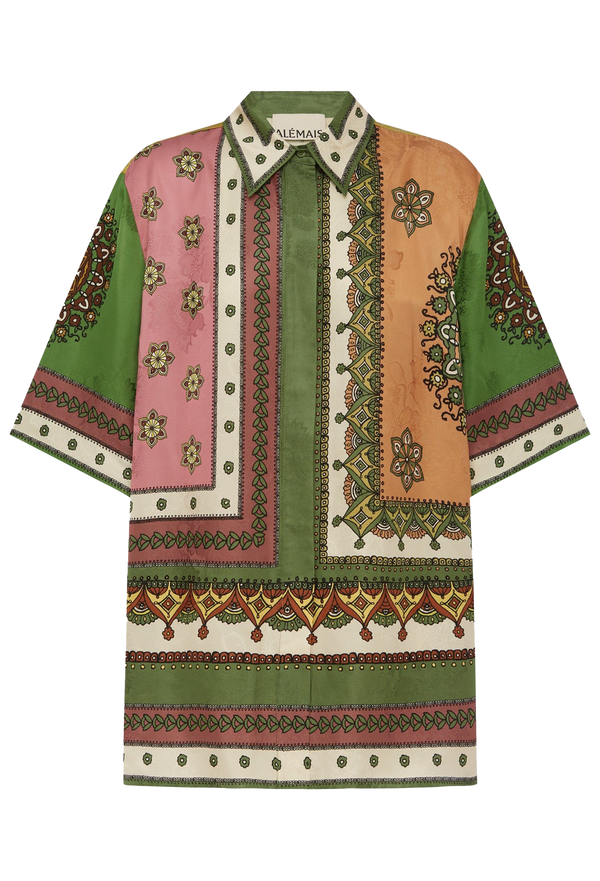 Colorful patterned shirt with a brand label on a white background