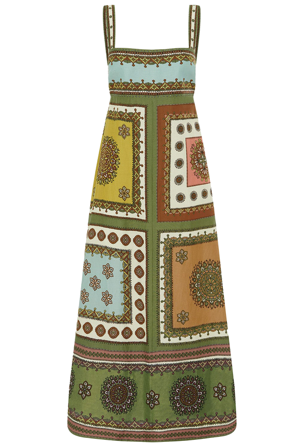 Colorful patterned dress with a green base on a white background