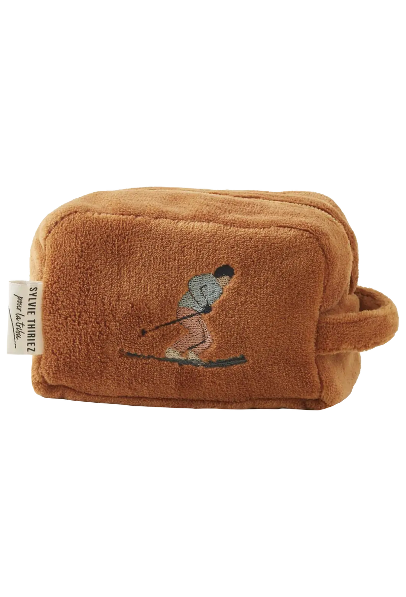 Brown plush pouch with embroidered design on a white background