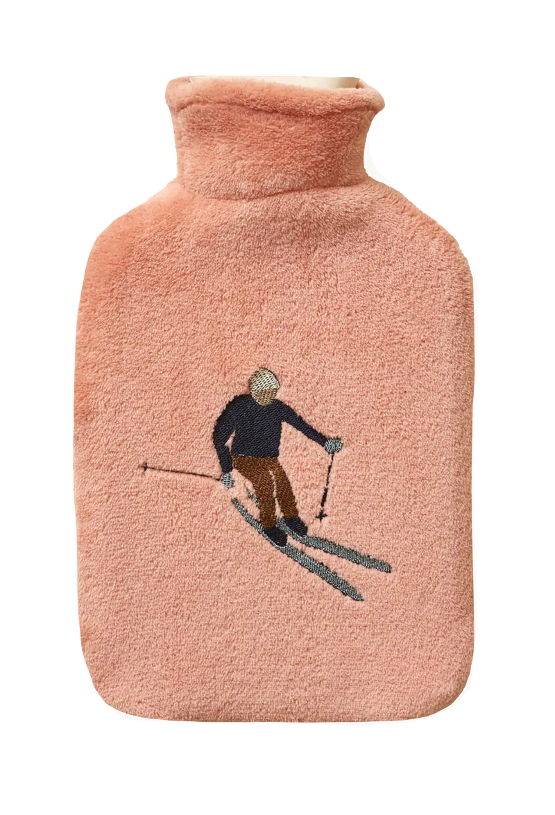 Pink hot water bottle with a skiing design on a white background