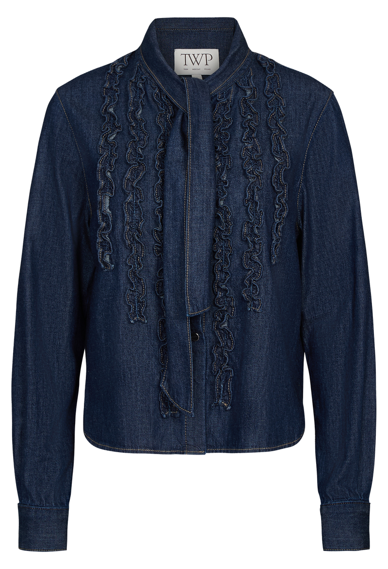 Blue denim shirt with ruffle details on a white background