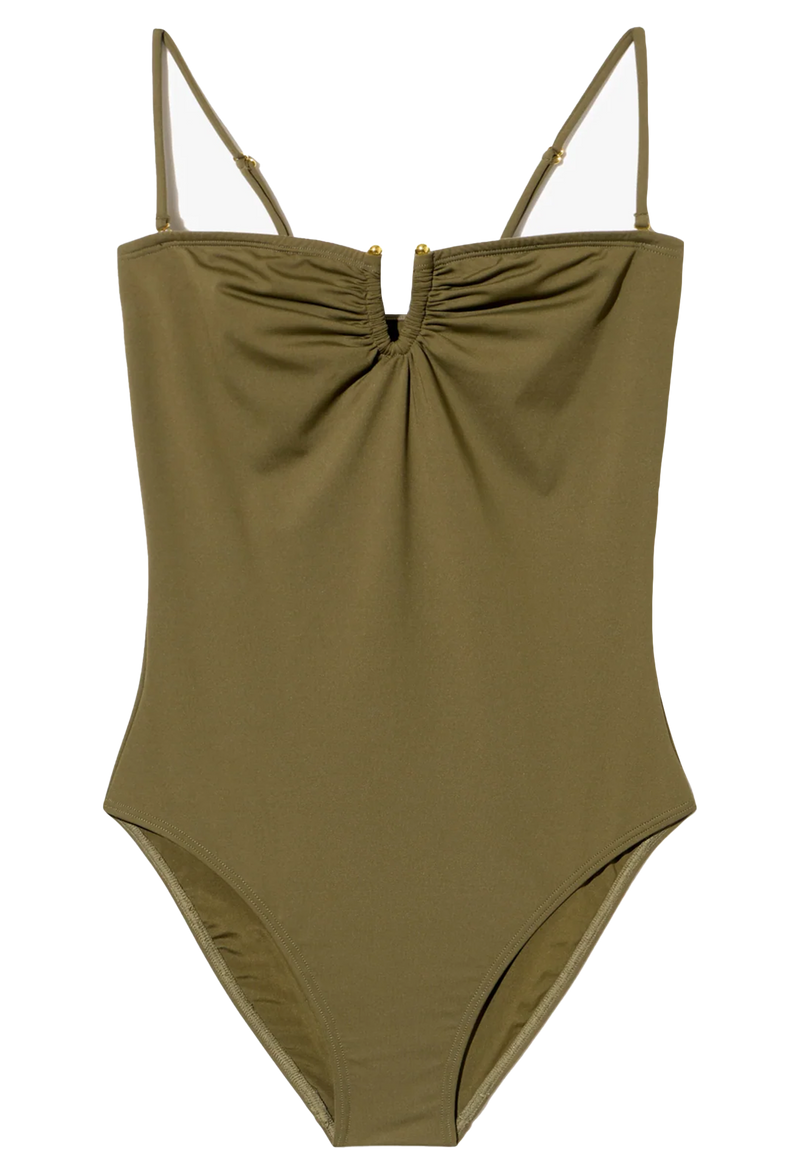 Green swimsuit with thin straps on a white background