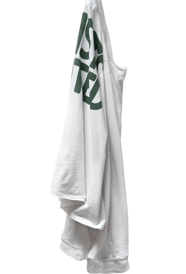 a model wearing a pink long sleeve tee with ARTISTS WANTED on the back