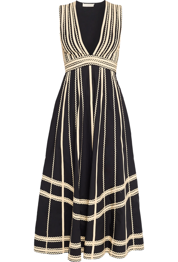Black dress with gold stripes on a white background