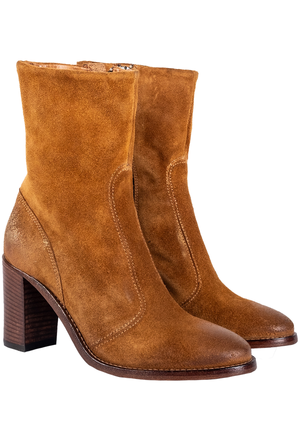 Pair of brown suede boots on a white background