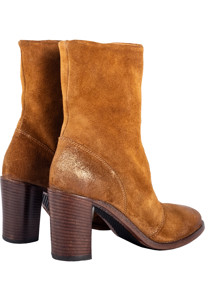 Pair of brown suede ankle boots on a white background