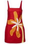 Red dress with a large orange and white floral design on a white background
