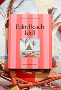 Puzzle box titled 'Palm Beach Idyll' with a beach scene on a striped background
