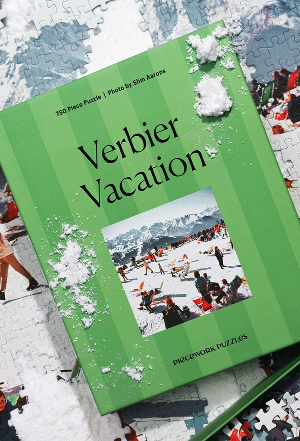 Green puzzle box titled 'Verbier Vacation' with a snowy scene on a partially completed puzzle.