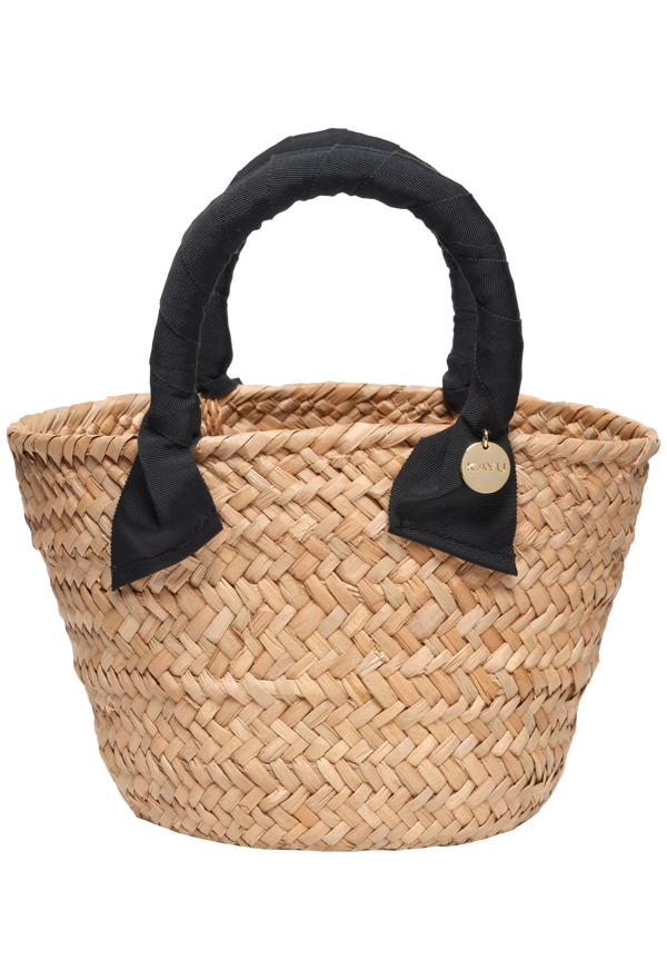Woven basket with black handles on a white background