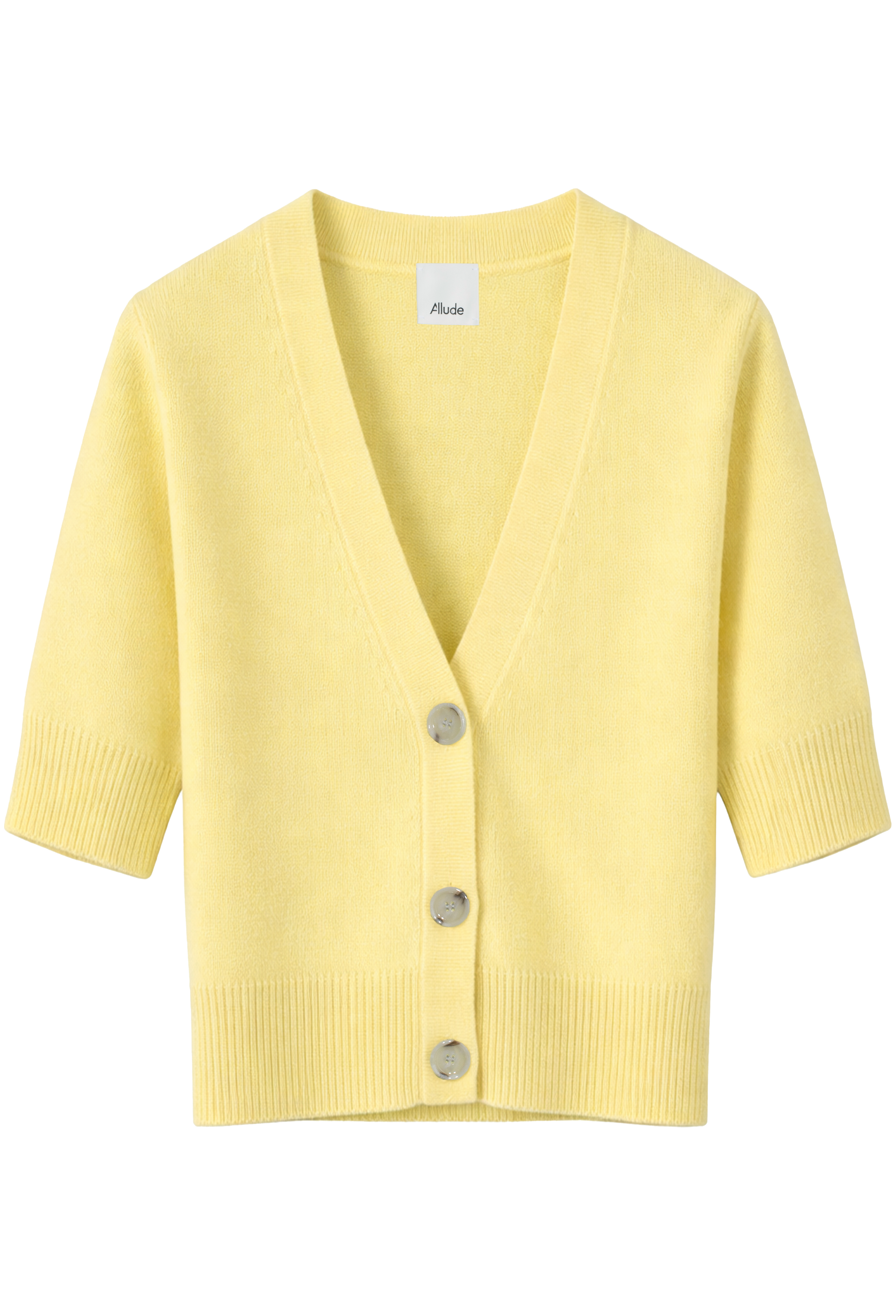 Yellow cardigan with buttons on a white background