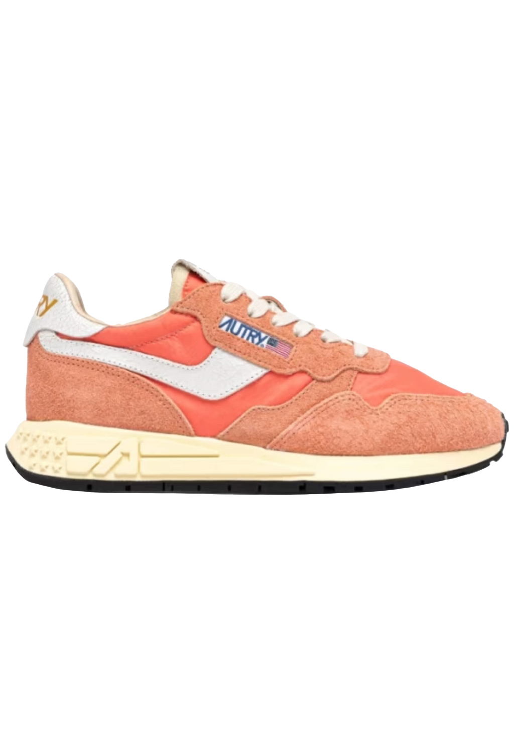 Coral sneaker with white accents on a white background