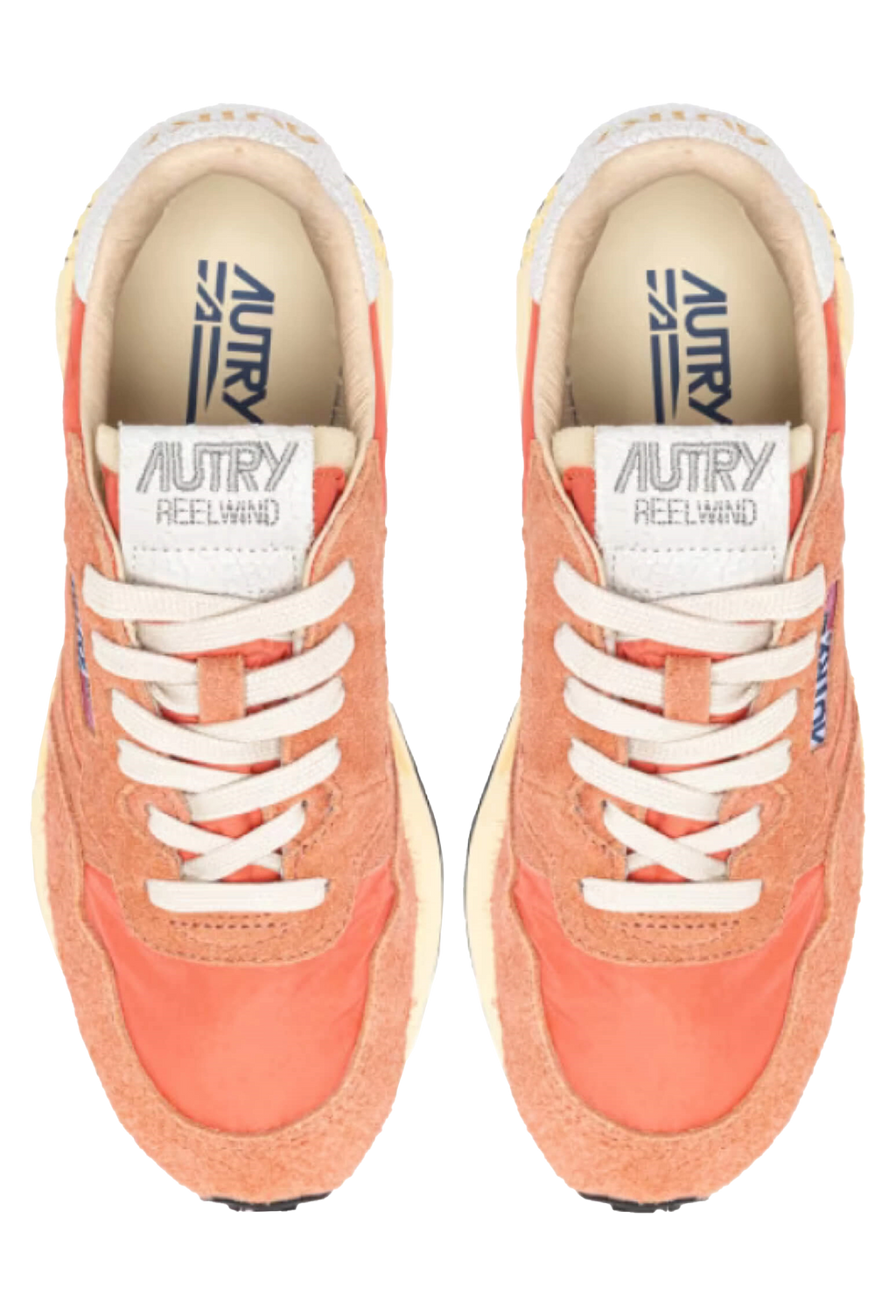 Pair of orange sneakers with white laces on a white background