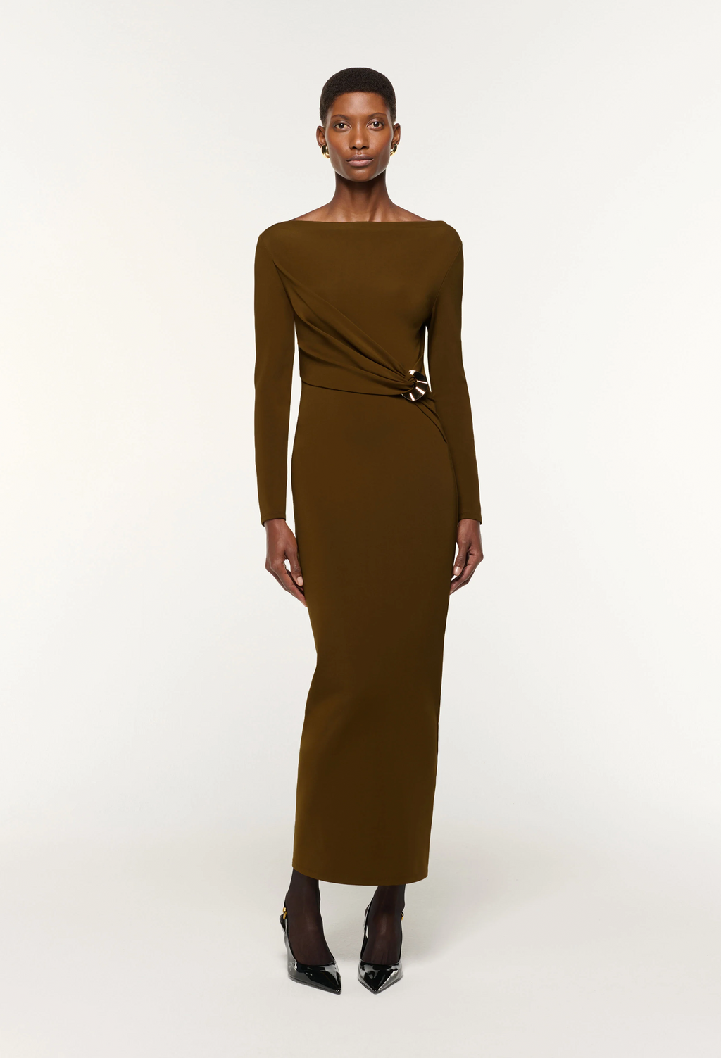 Woman wearing a brown dress on a white background
