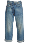 crossover blue jeans with a white background