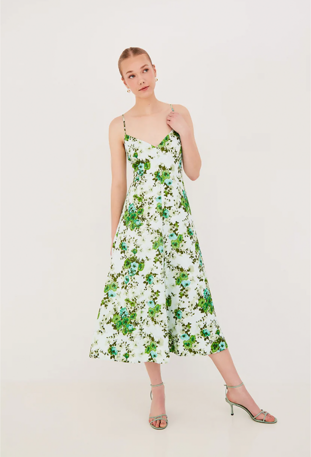 Woman wearing a floral dress on a white background