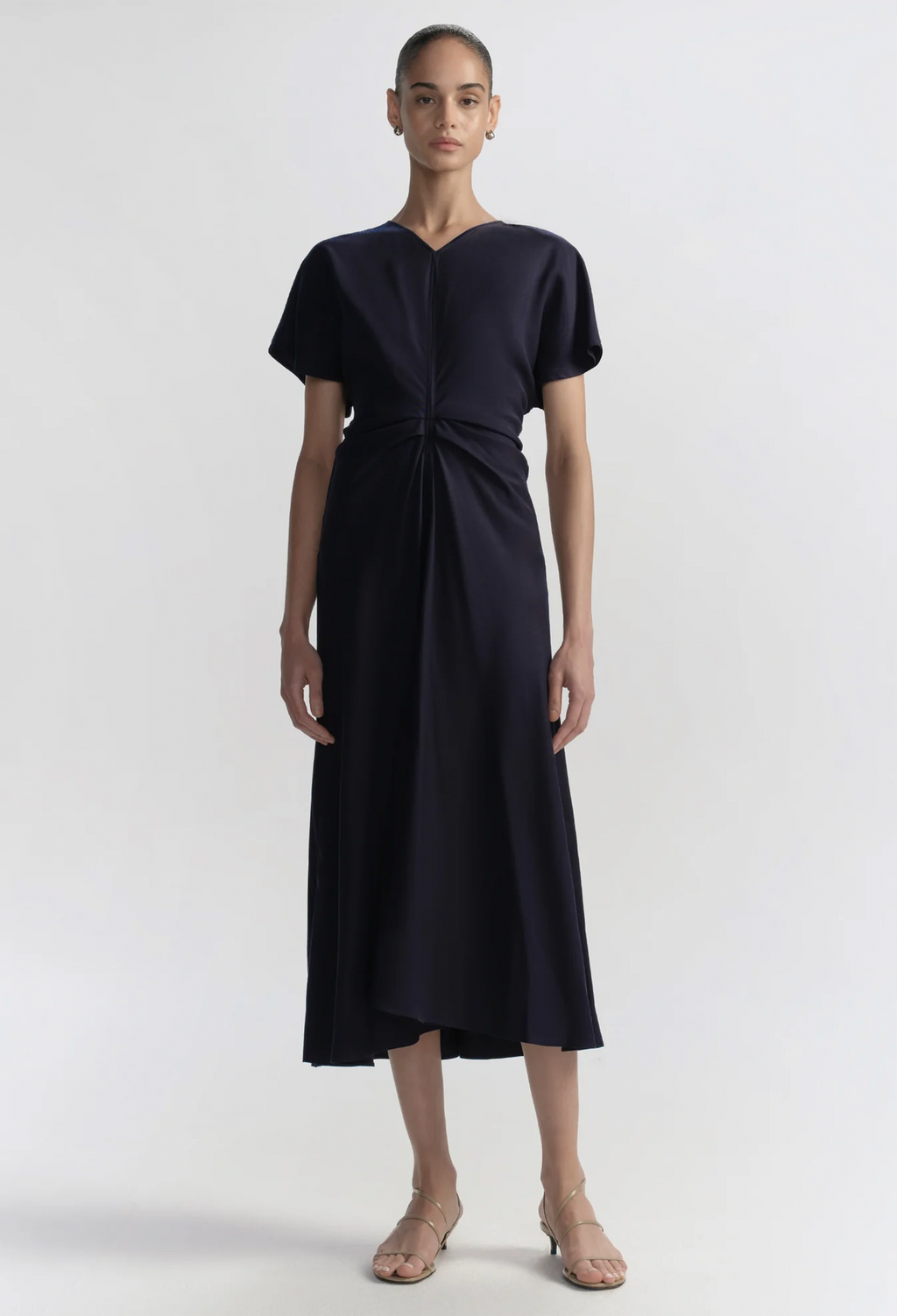 Woman wearing a blue dress on a white background