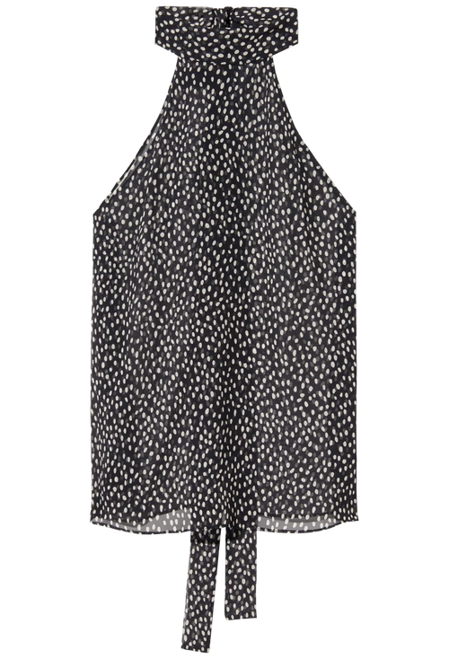 Black and white polka dot top on a white background