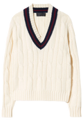 Cream-colored sweater with a V-neck and red and blue trim on a white background