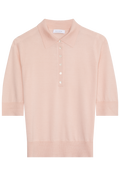 Pink polo shirt on a white background