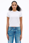 Person wearing a white t-shirt and blue jeans on a white background