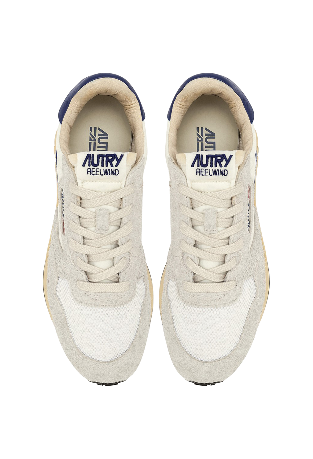 Pair of white sneakers with blue accents on a white background