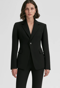 Person wearing a black suit on a white background